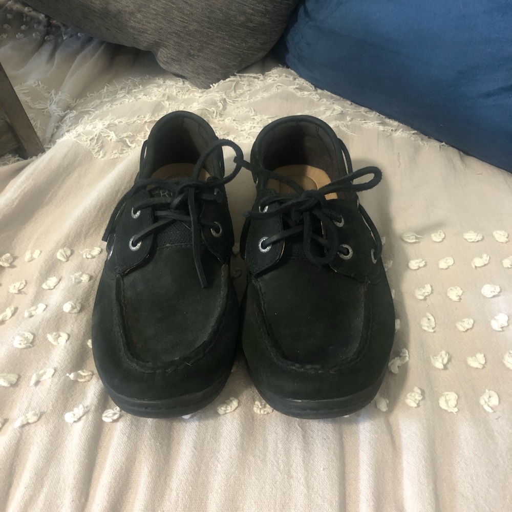 All black Sperry shoes